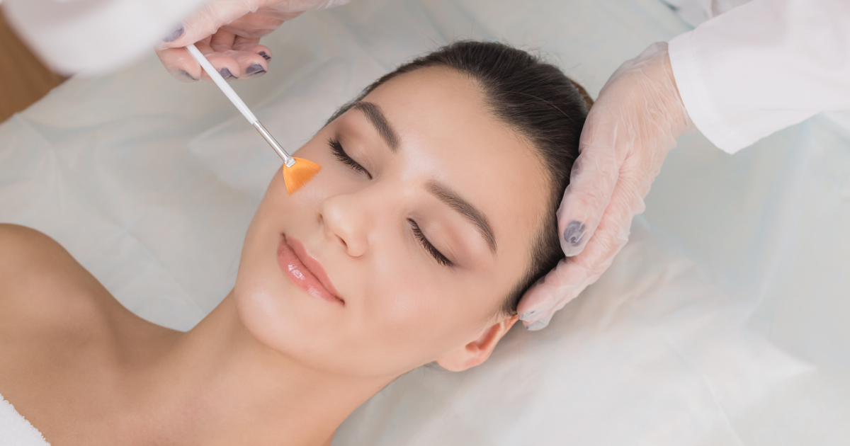 Woman receiving chemical peels facial treatment at spa in Missoula, MT