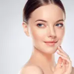 Woman showing glowing, even skin after IPL photofacial treatment
